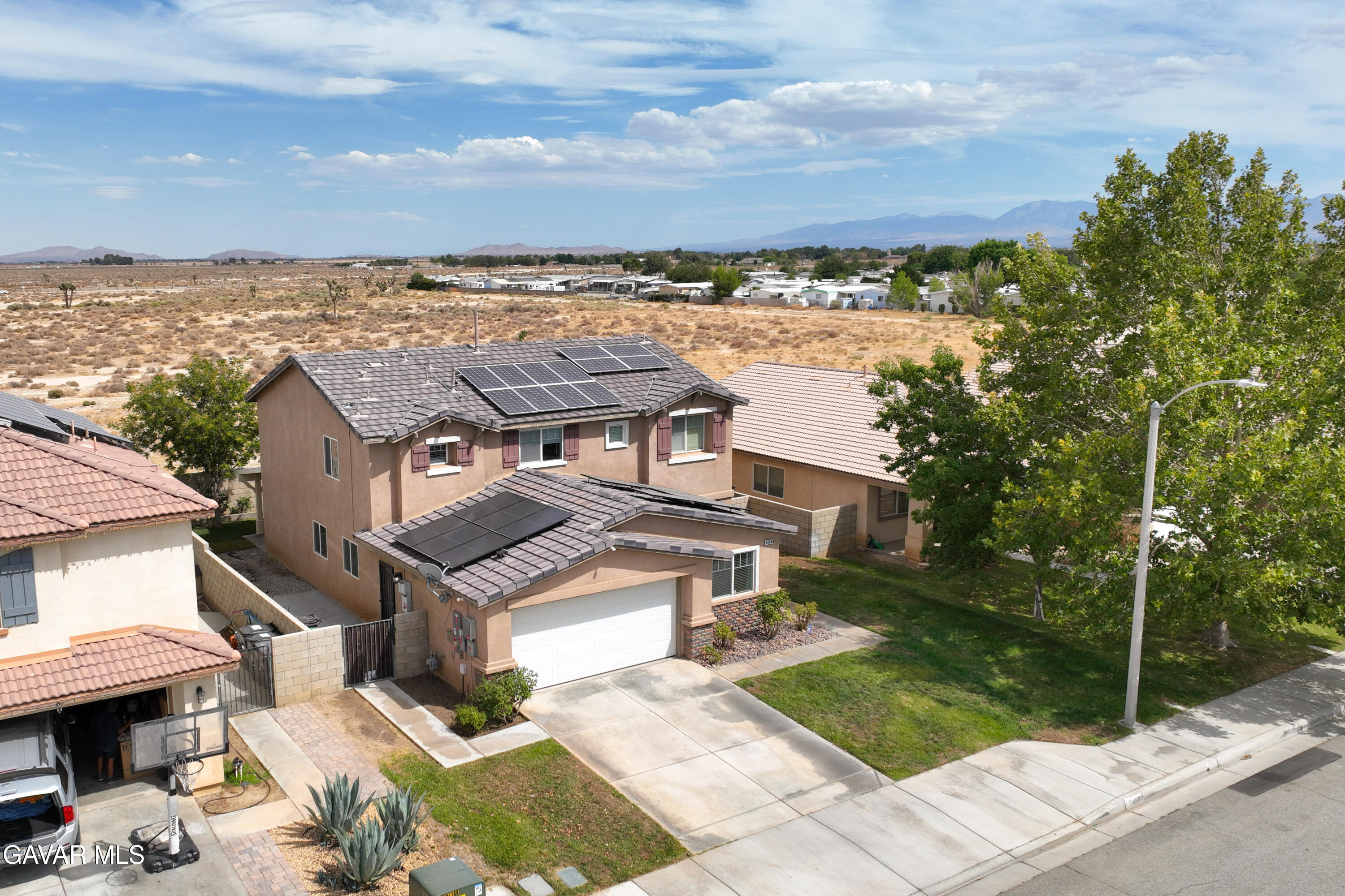 45448 Spahn Lane Lancaster, CA 93535 - Photo 45 of 49 a view of a terrace with a garden