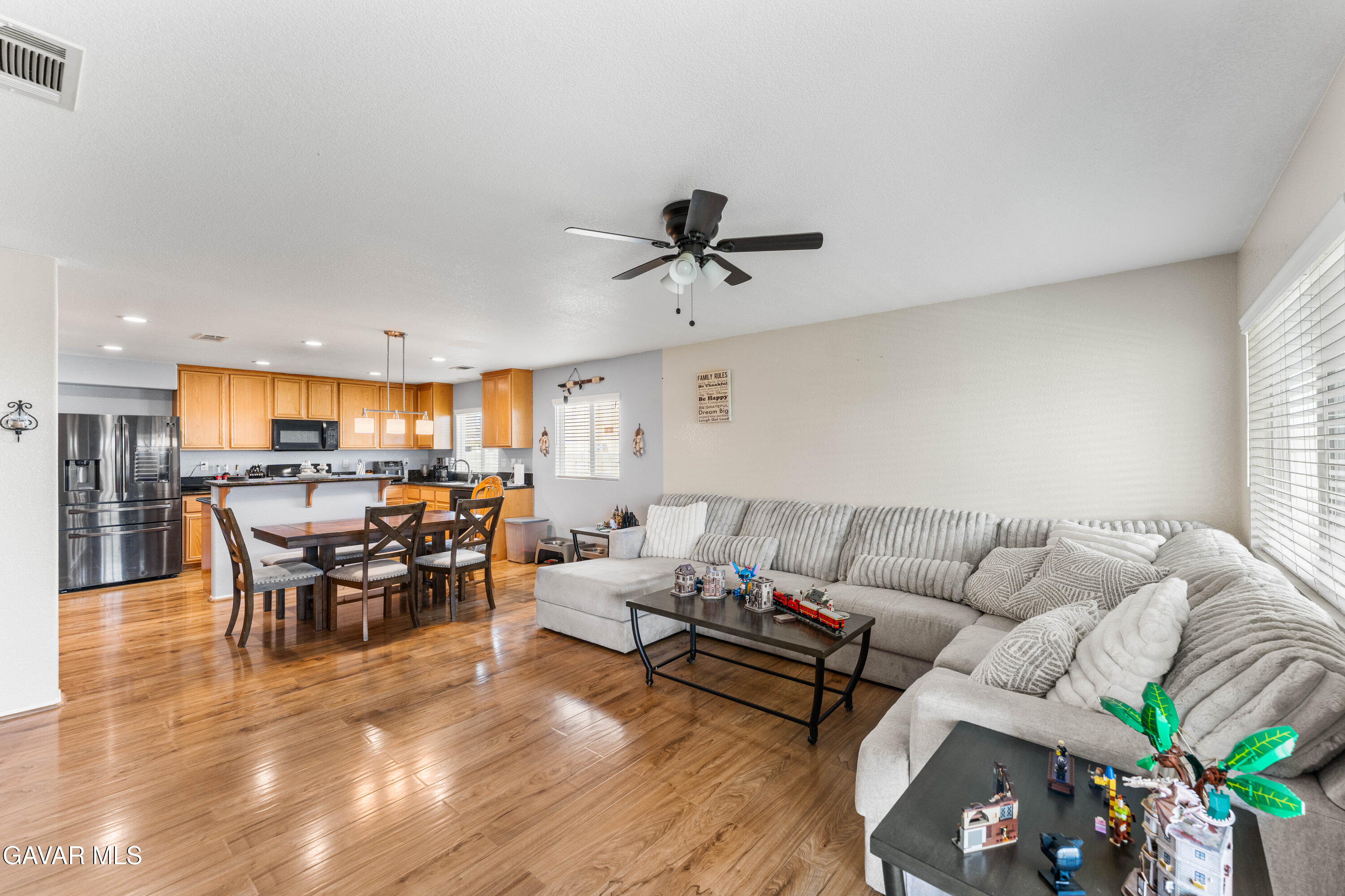 45448 Spahn Lane Lancaster, CA 93535 - Photo 5 of 49 a living room with furniture kitchen view and a chandelier