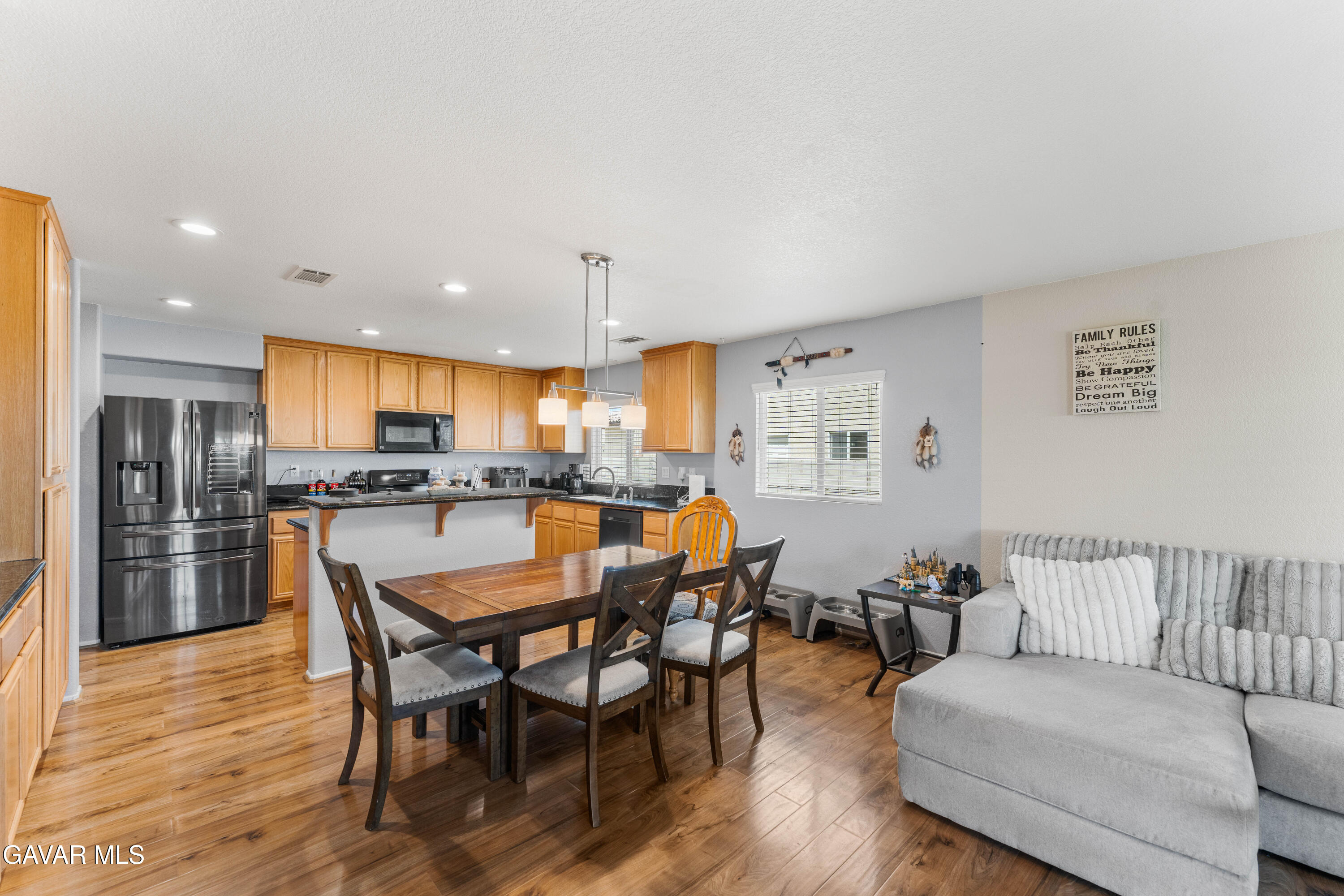 45448 Spahn Lane Lancaster, CA 93535 - Photo 6 of 49 a dining room with furniture and wooden floor