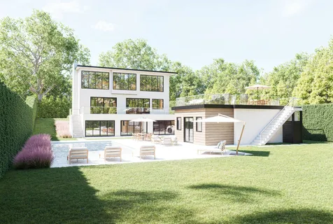a front view of a house with a yard table and chairs