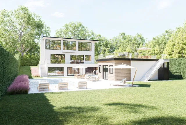 a front view of a house with a yard table and chairs