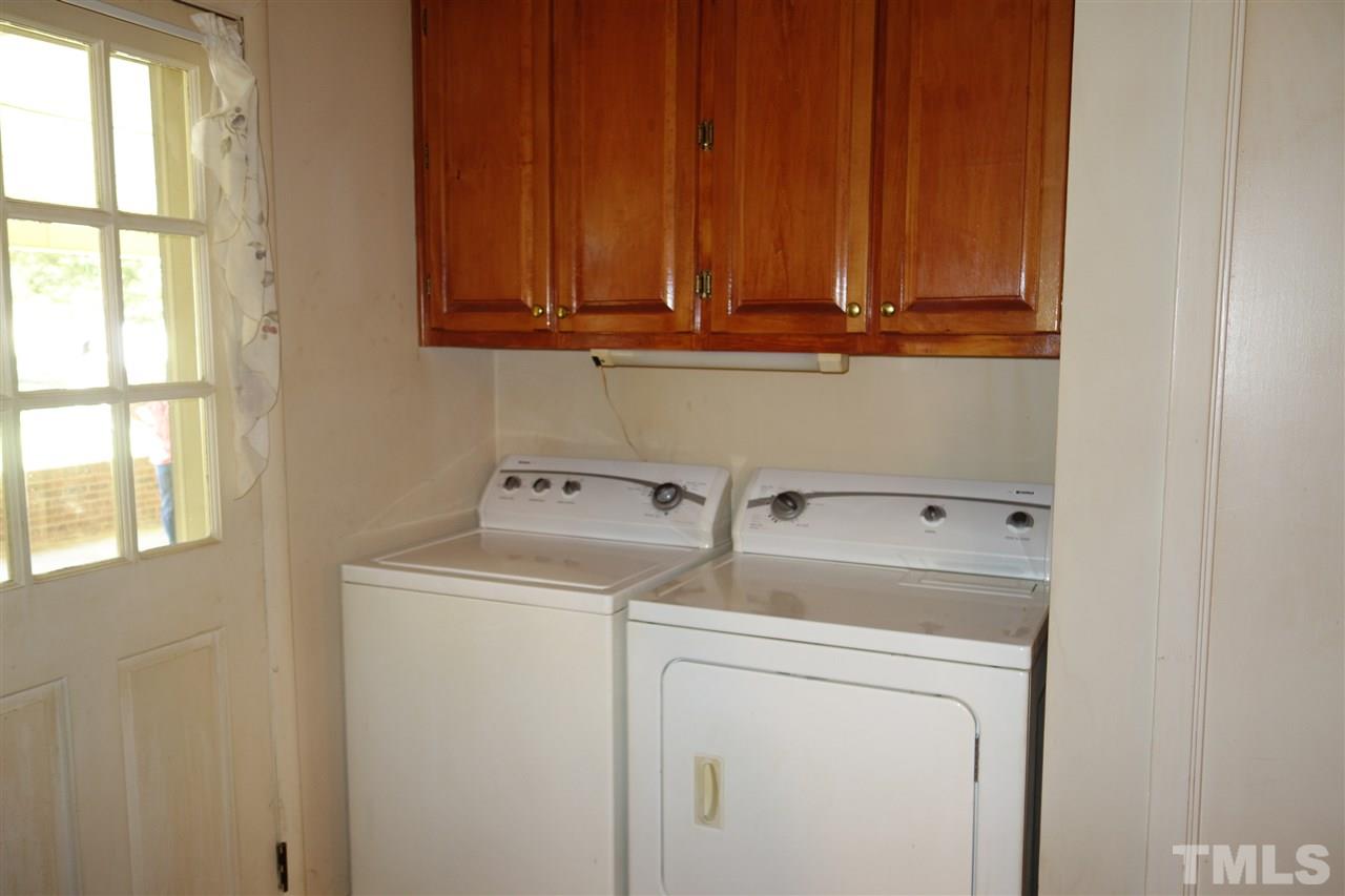 4444 Glebe Road Henderson, NC 27537 - Photo 9 of 19 The laundry area is in the kitchen area