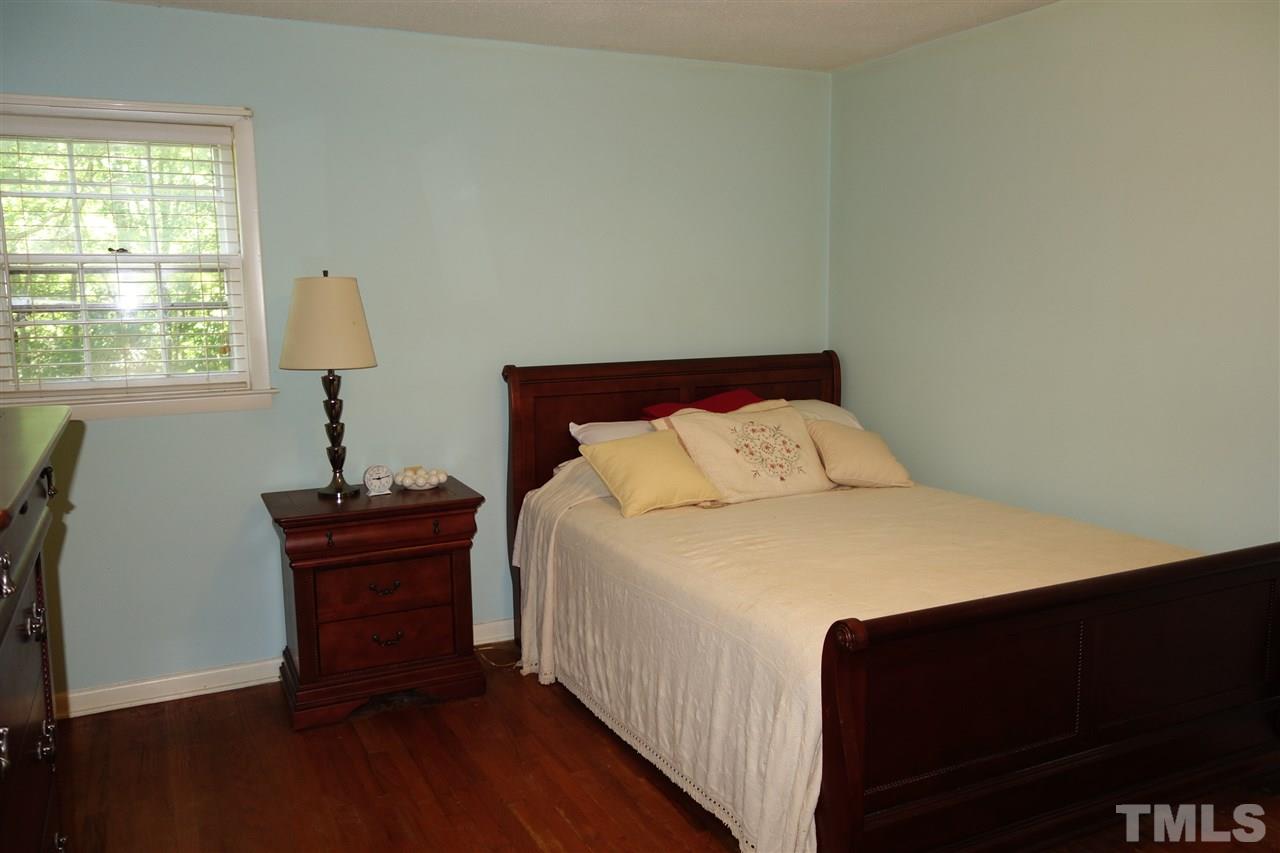4444 Glebe Road Henderson, NC 27537 - Photo 10 of 19 Master bedroom with hardwood floor and private bath