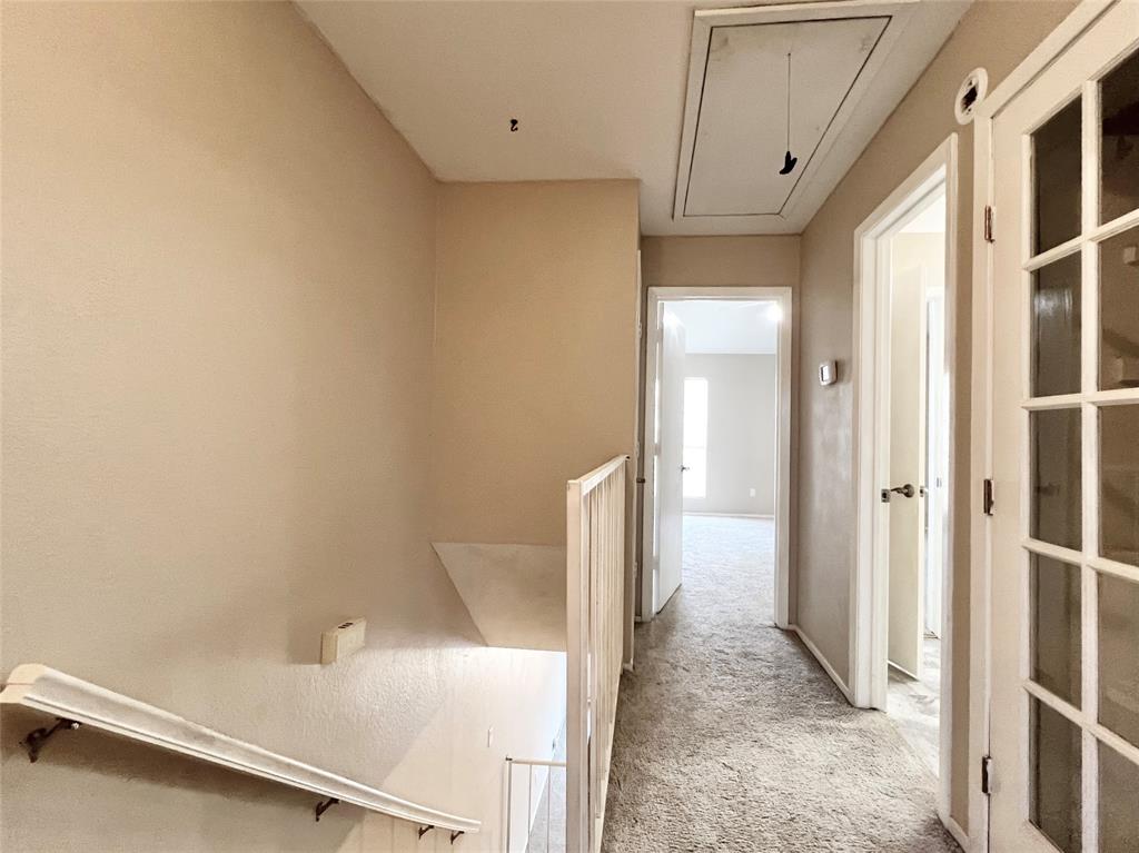 168 Merlin Way Euless, TX 76039 - Photo 11 of 24 Top of the stairs, heading towards full bathroom and primary bedroom