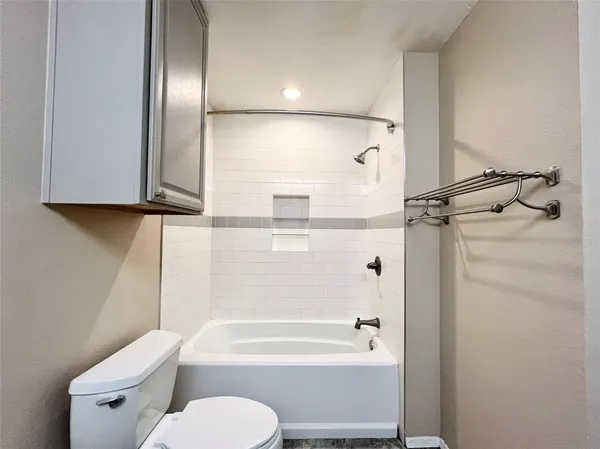 a bathroom with a double vanity sink mirror and shower