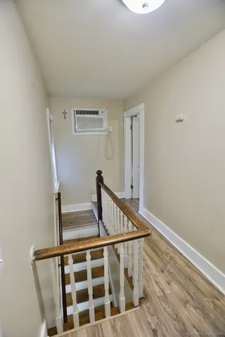 a view of entryway with wooden floor