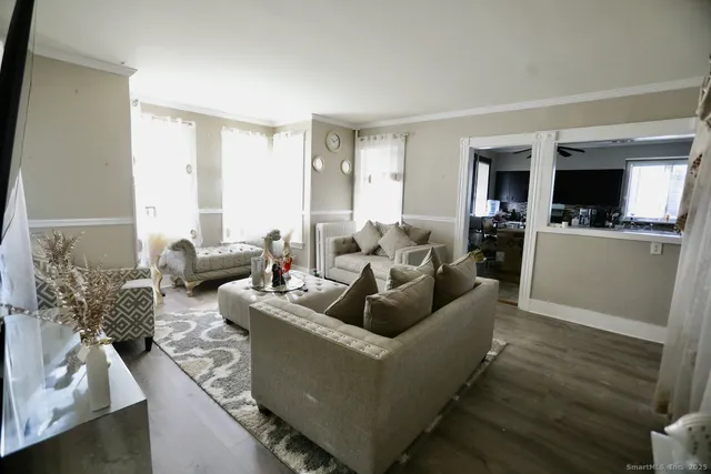 a living room with furniture and a table