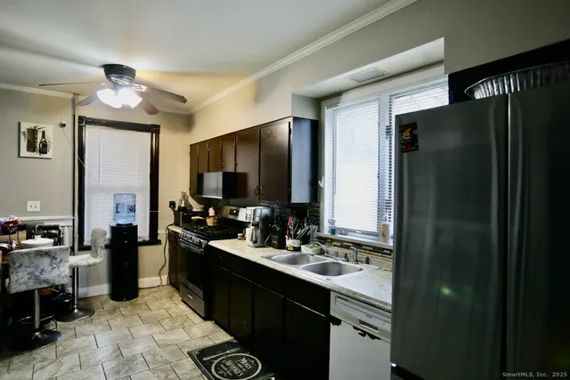 a kitchen with a refrigerator and a sink