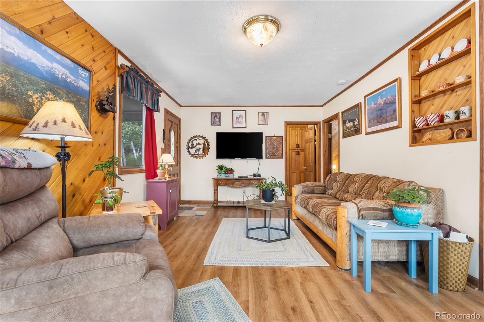 11948 Apache Trail Conifer, CO 80433 - Photo 13 of 45 a living room with furniture and a flat screen tv