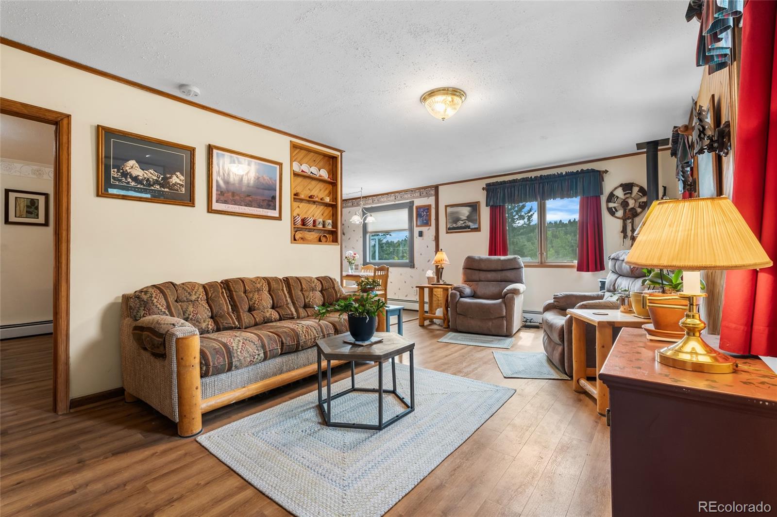 11948 Apache Trail Conifer, CO 80433 - Photo 14 of 45 a living room with furniture and a lamp