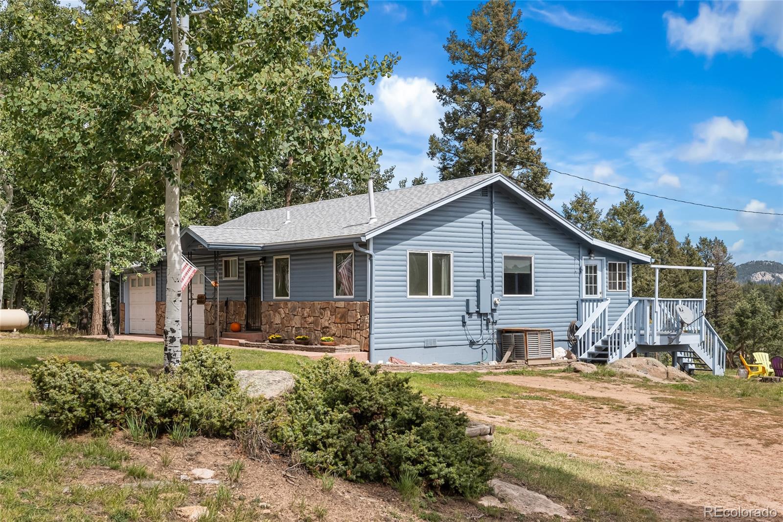 11948 Apache Trail Conifer, CO 80433 - Photo 2 of 45 a view of a house with backyard