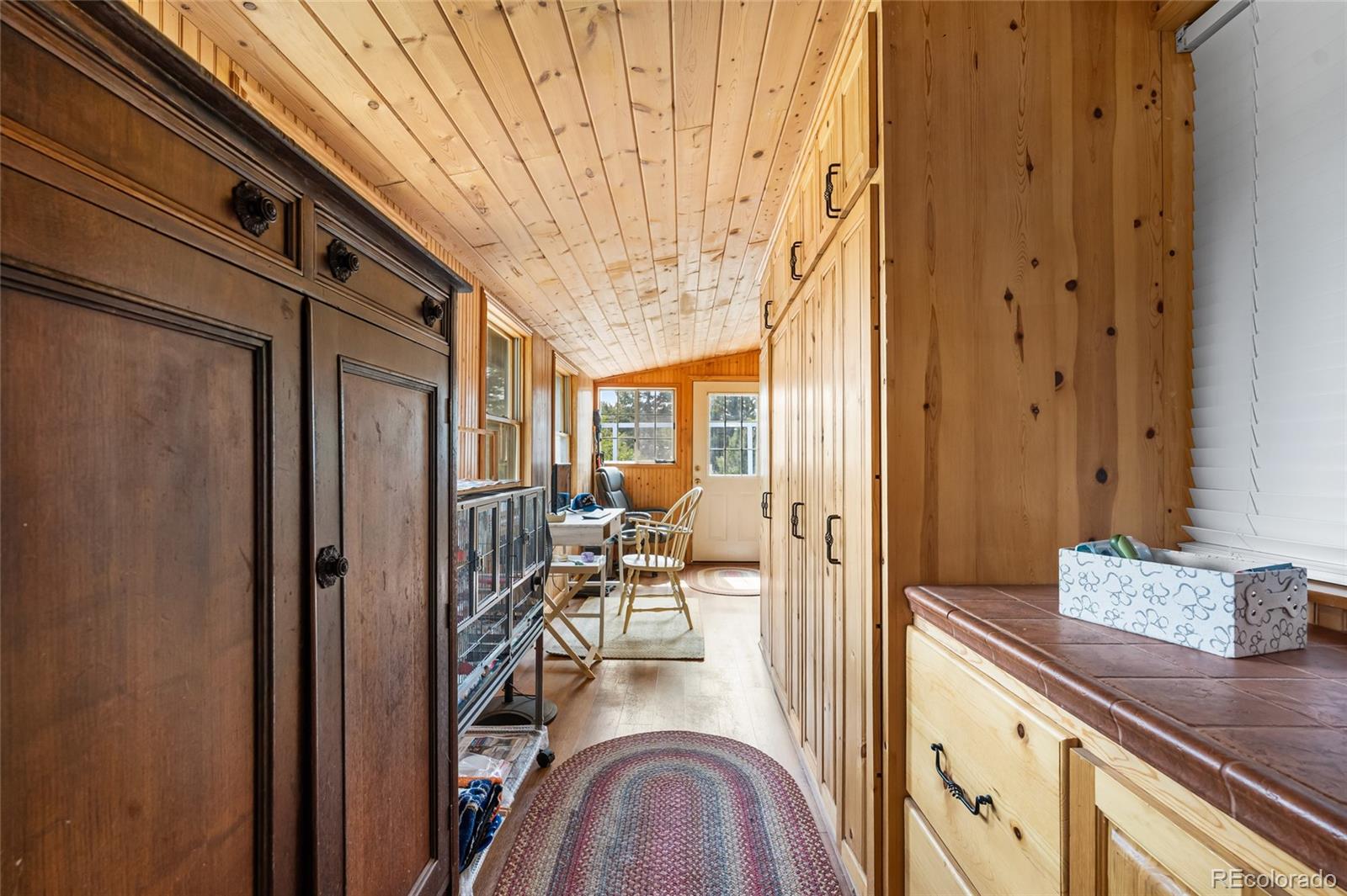 11948 Apache Trail Conifer, CO 80433 - Photo 22 of 45 a view of a hallway with living room and furniture