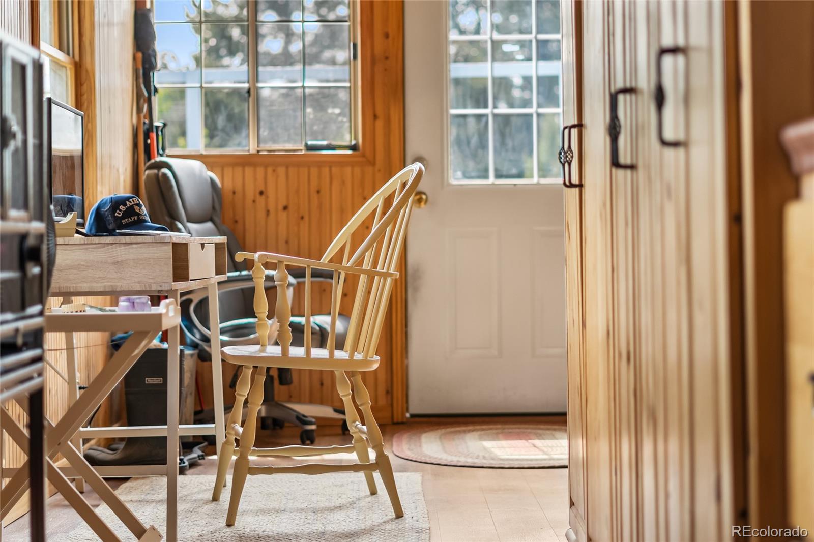 11948 Apache Trail Conifer, CO 80433 - Photo 23 of 45 a view of a room with wooden floor and windows