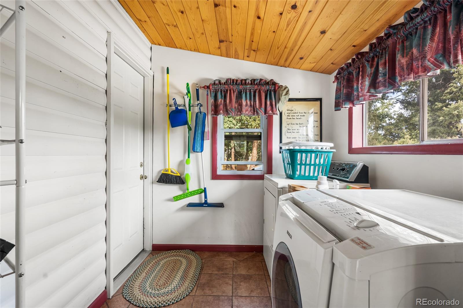11948 Apache Trail Conifer, CO 80433 - Photo 24 of 45 a utility room with dryer and washer