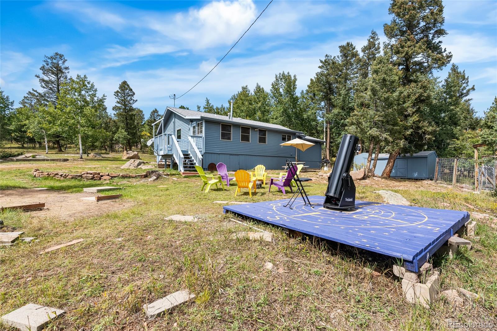 11948 Apache Trail Conifer, CO 80433 - Photo 29 of 45 a view of a backyard with sitting area