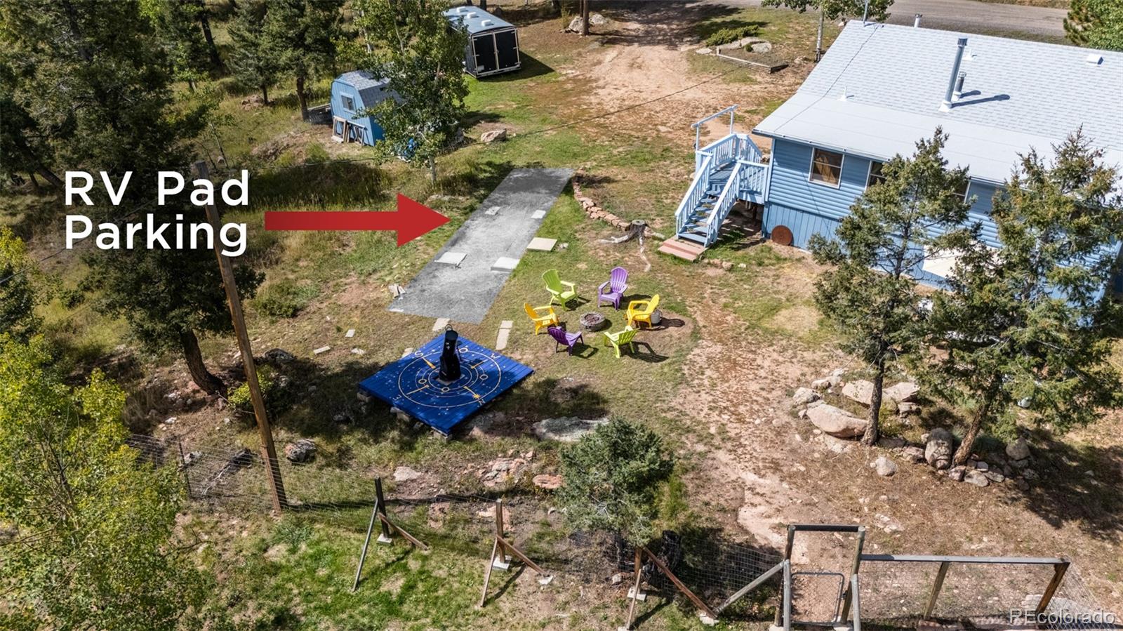 11948 Apache Trail Conifer, CO 80433 - Photo 31 of 45 an aerial view of a house with a yard and covered with swimming pool