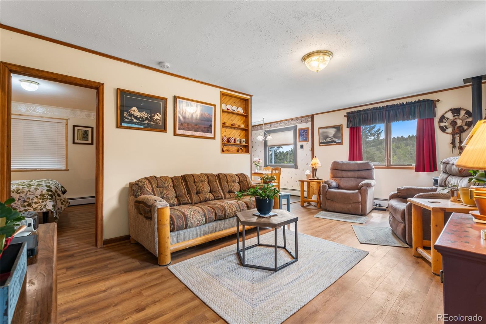 11948 Apache Trail Conifer, CO 80433 - Photo 4 of 45 a living room with furniture a rug and a window