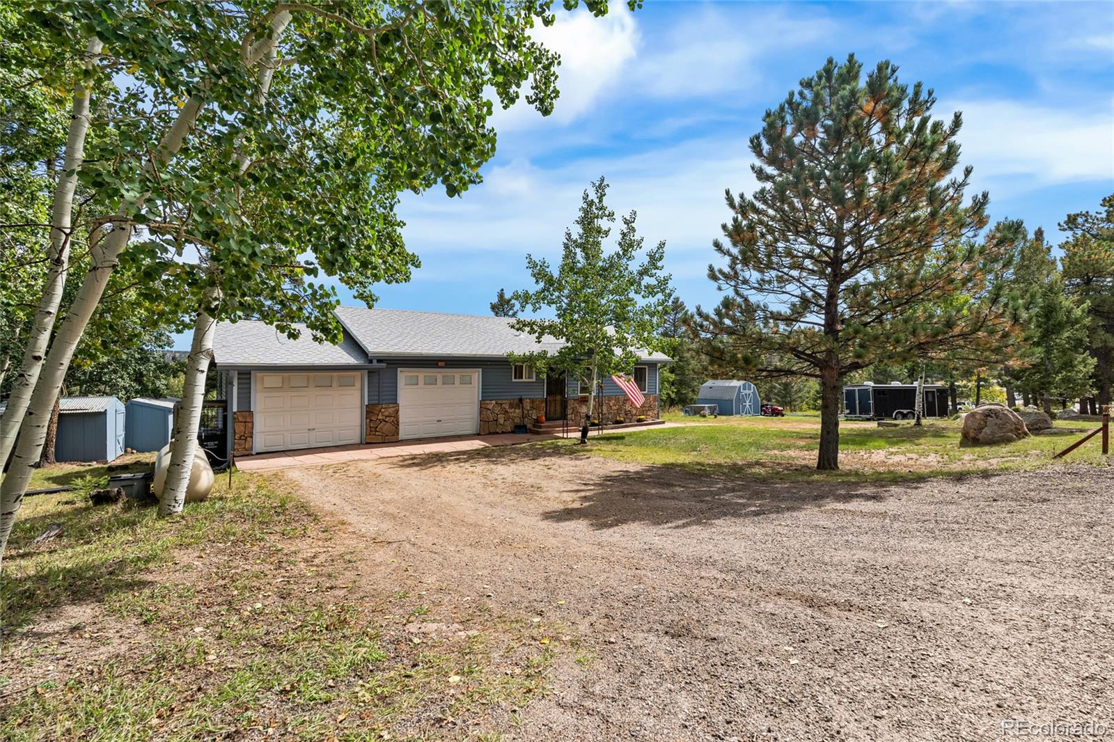11948 Apache Trail Conifer, CO 80433 - Photo 42 of 45 a house with trees in front of it
