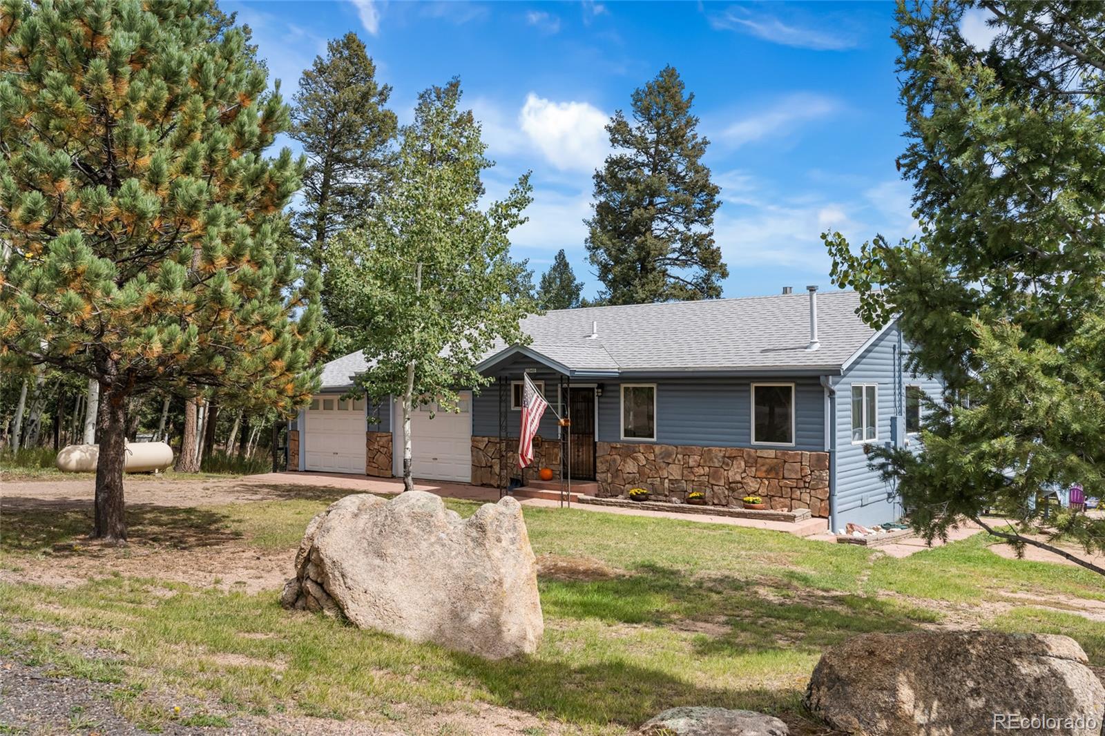 11948 Apache Trail Conifer, CO 80433 - Photo 44 of 45 a view of a house with a yard