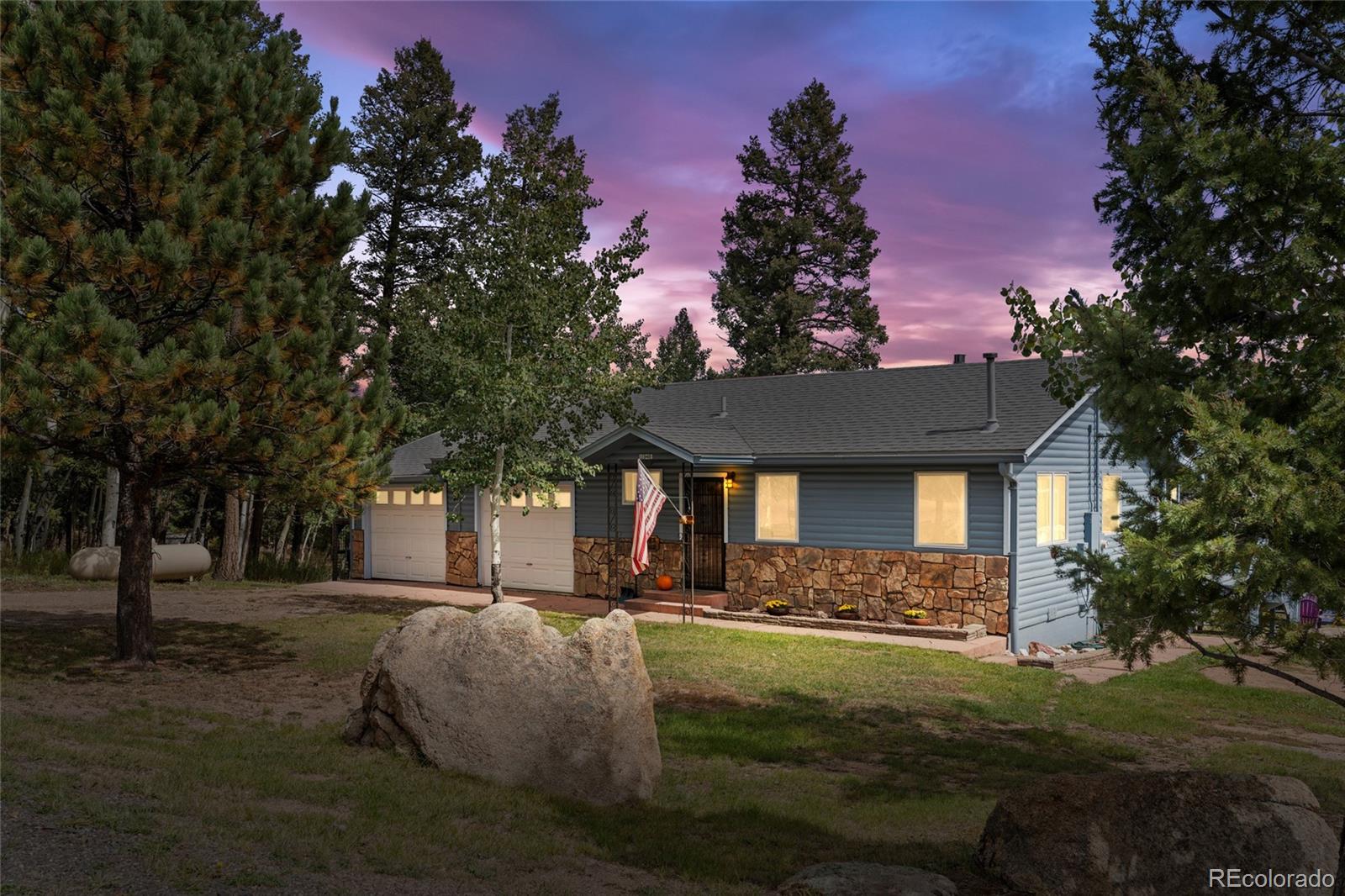 11948 Apache Trail Conifer, CO 80433 - Photo 45 of 45 a front view of a house with a yard