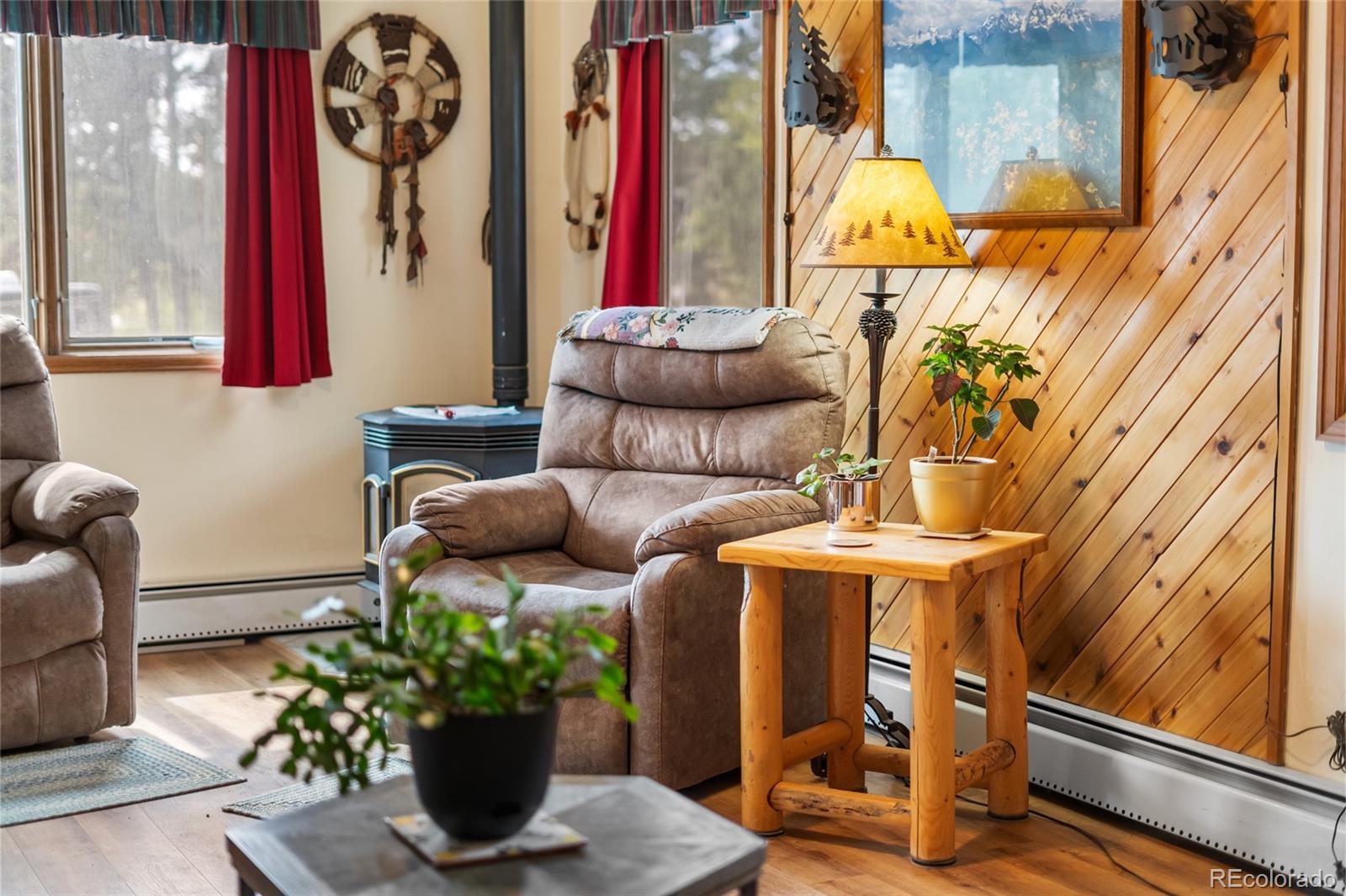 11948 Apache Trail Conifer, CO 80433 - Photo 6 of 45 a view of a entryway with flower pots