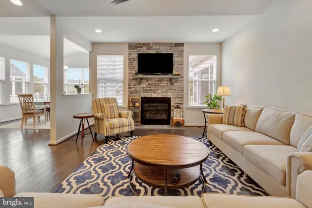 a kitchen with a sink cabinets and wooden floor