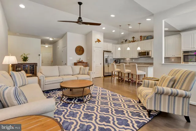 a kitchen with stainless steel appliances granite countertop a lot of counter space and a sink