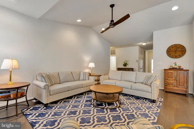 a view of a dining room with furniture and a potted plant
