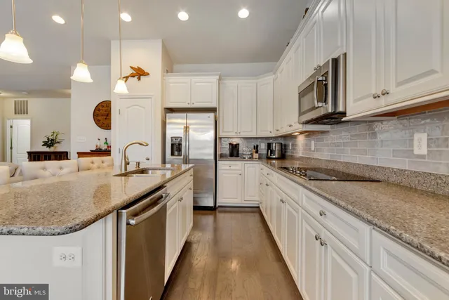 a view of a chairs and table in the balcony