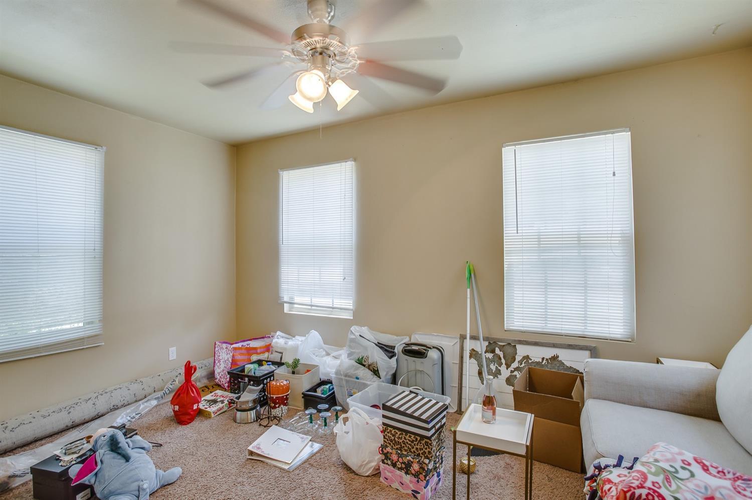 3114 30th Street Lubbock, TX 79410 - Photo 11 of 19 a living room with furniture and a window