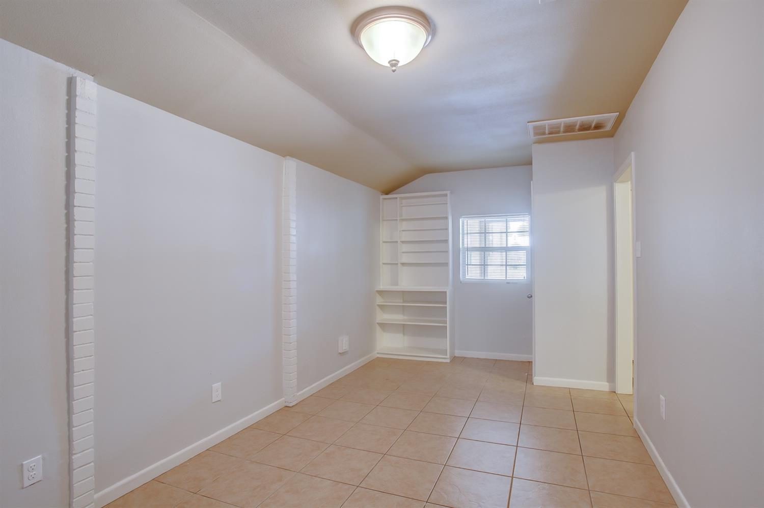 3114 30th Street Lubbock, TX 79410 - Photo 16 of 19 a view of walk in closet with window