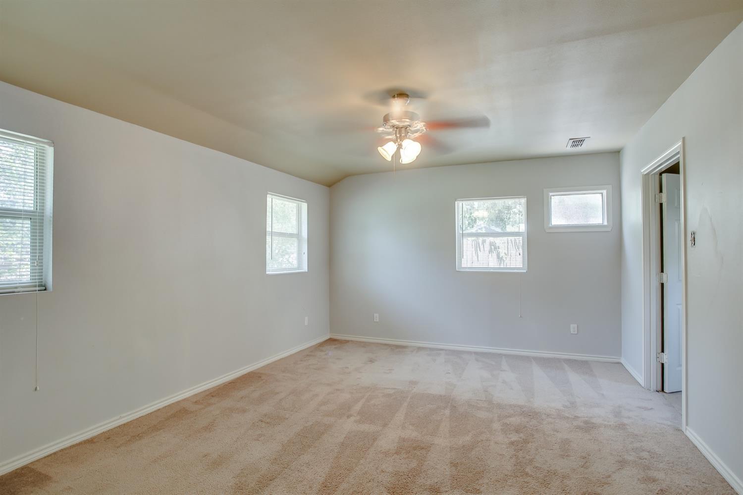3114 30th Street Lubbock, TX 79410 - Photo 18 of 19 a view of empty room with windows