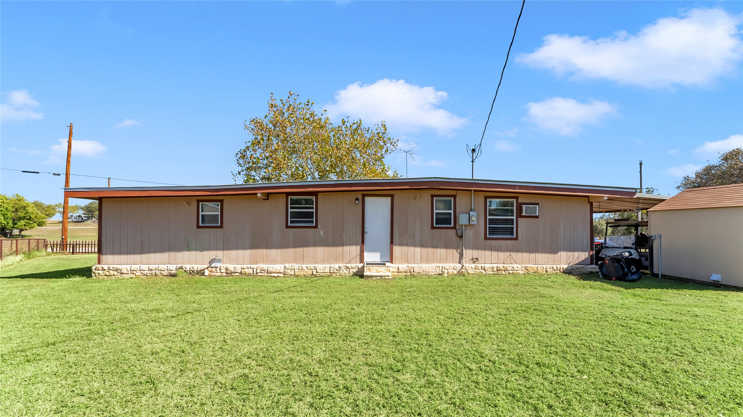 1415 Bee Lane Tow, TX 78672 - Photo 15 of 39 a house view with a sitting space and garden