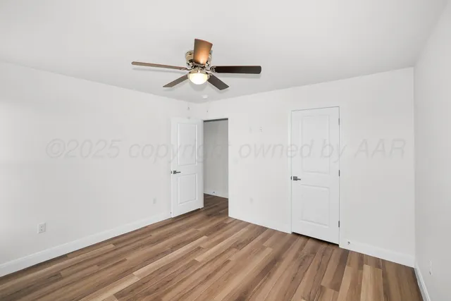 a view of an empty walk in closet