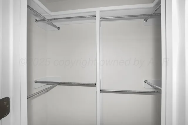 a bathroom with a double vanity sink double mirror and a shower