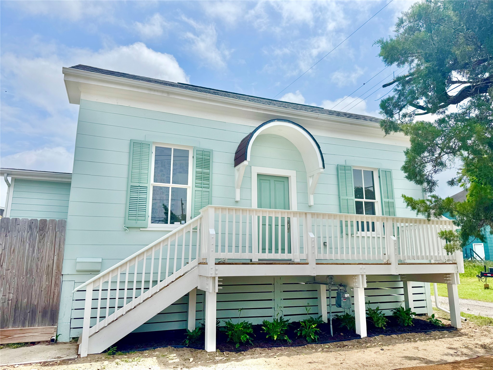 1312 35th Street Galveston, TX 77550 - Photo 1 of 32 a view of a house with a wooden deck