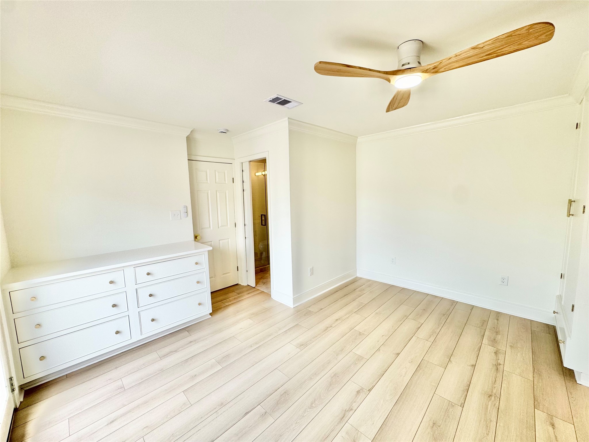 1312 35th Street Galveston, TX 77550 - Photo 21 of 32 a view of an empty room with wooden floor