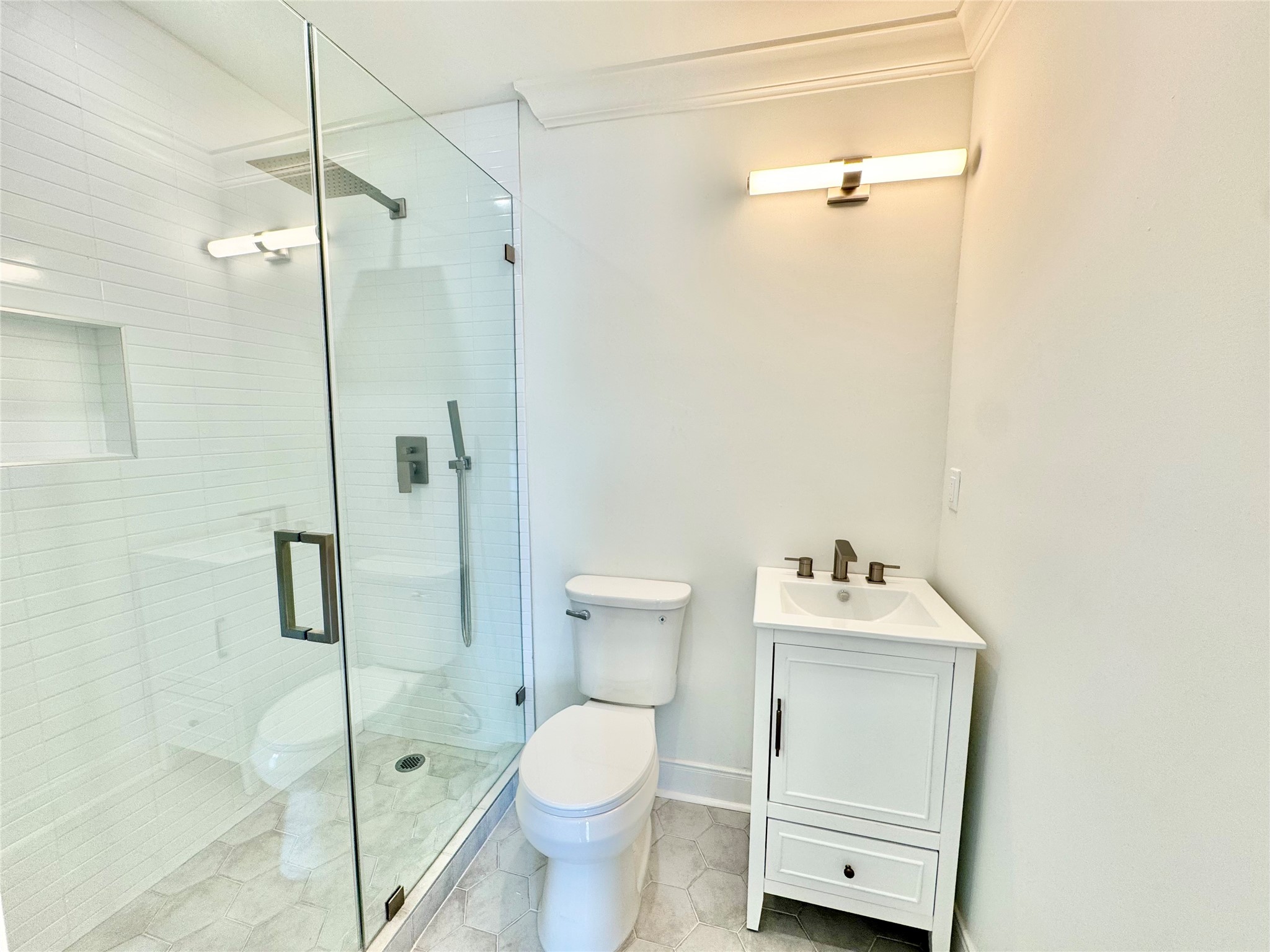 1312 35th Street Galveston, TX 77550 - Photo 23 of 32 a bathroom with a toilet sink and shower