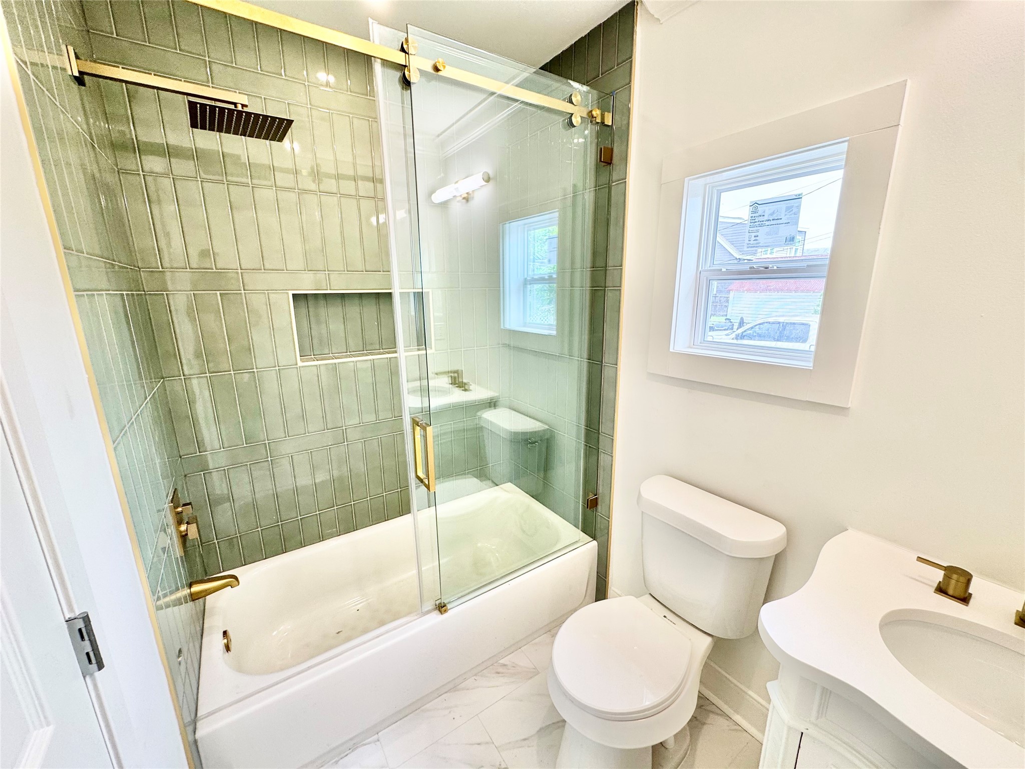 1312 35th Street Galveston, TX 77550 - Photo 27 of 32 a bathroom with a toilet and a shower