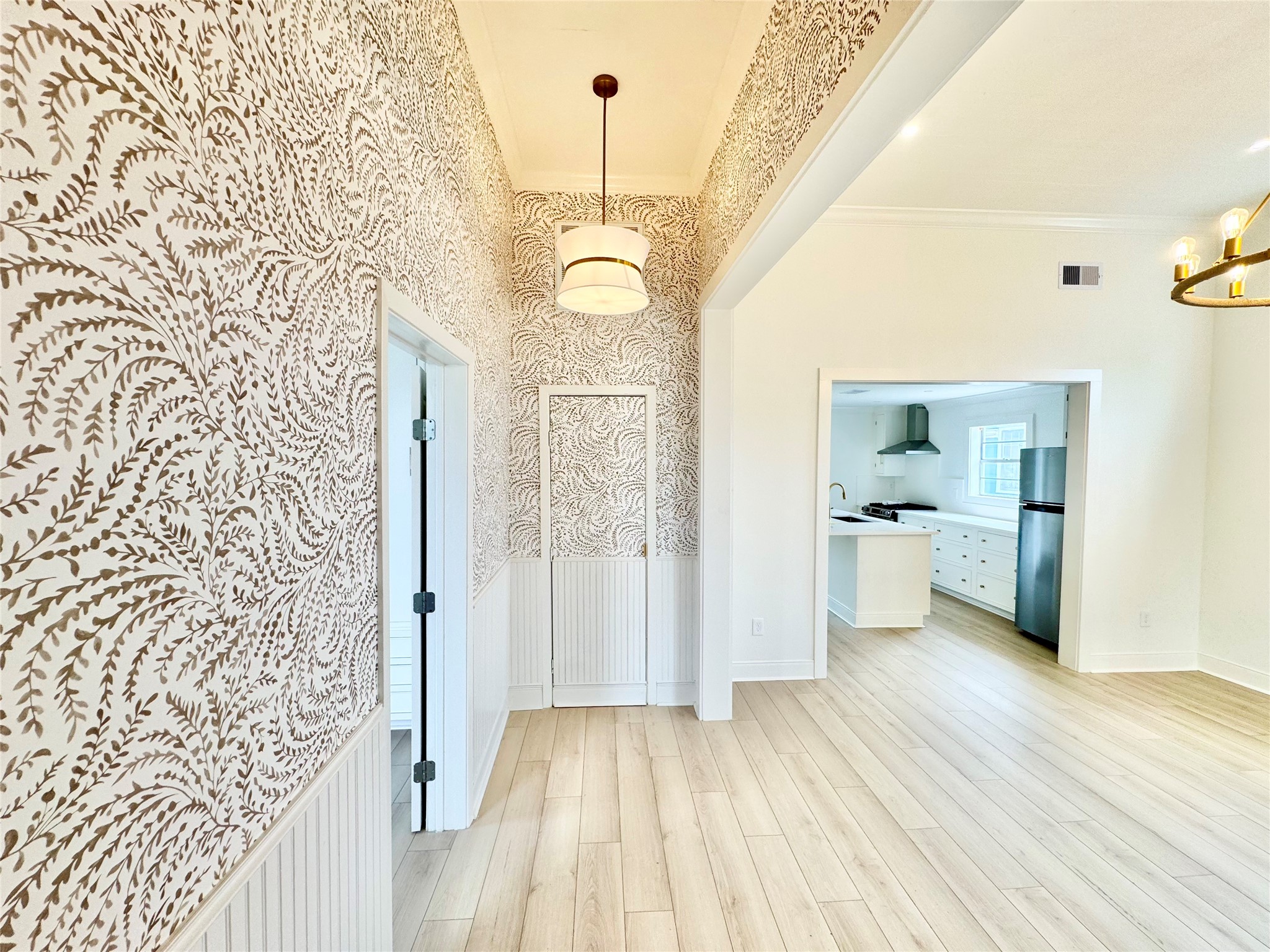 1312 35th Street Galveston, TX 77550 - Photo 5 of 32 a view of a hallway view with wooden floor and staircase
