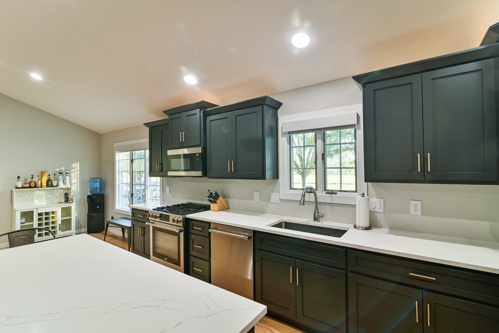 9220 Heritage Road Clinton, IL 61727 - Photo 13 of 37 a kitchen with stainless steel appliances a sink stove and cabinets