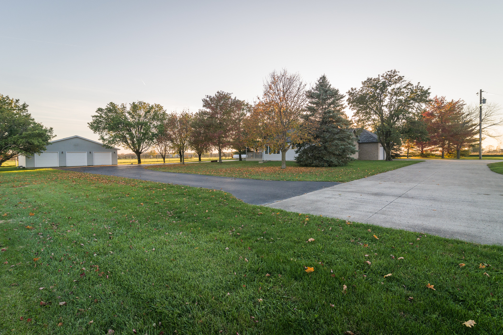 9220 Heritage Road Clinton, IL 61727 - Photo 2 of 37 a view of a big yard with plants and large trees