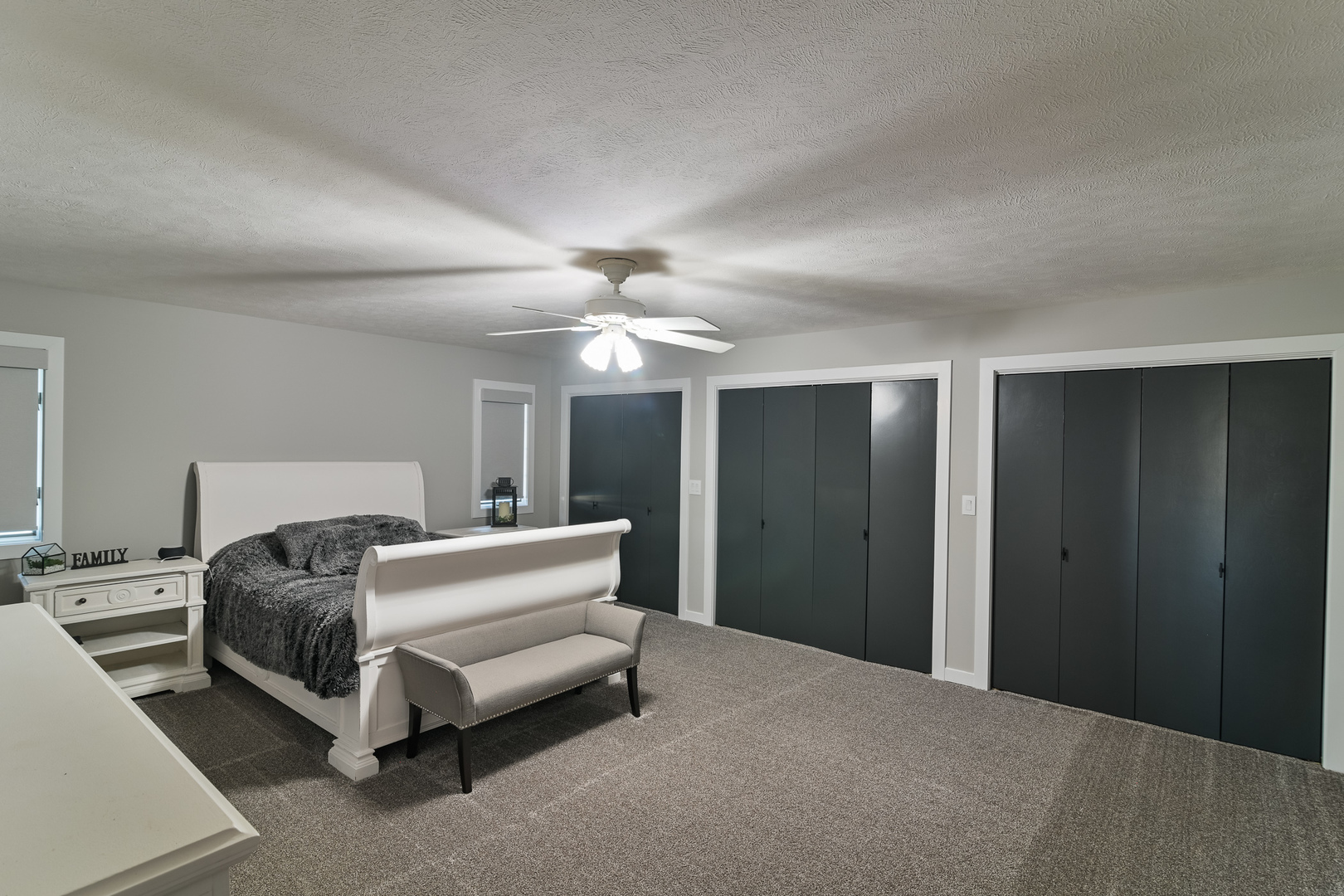 9220 Heritage Road Clinton, IL 61727 - Photo 22 of 37 a bed room with a bed and a ceiling fan