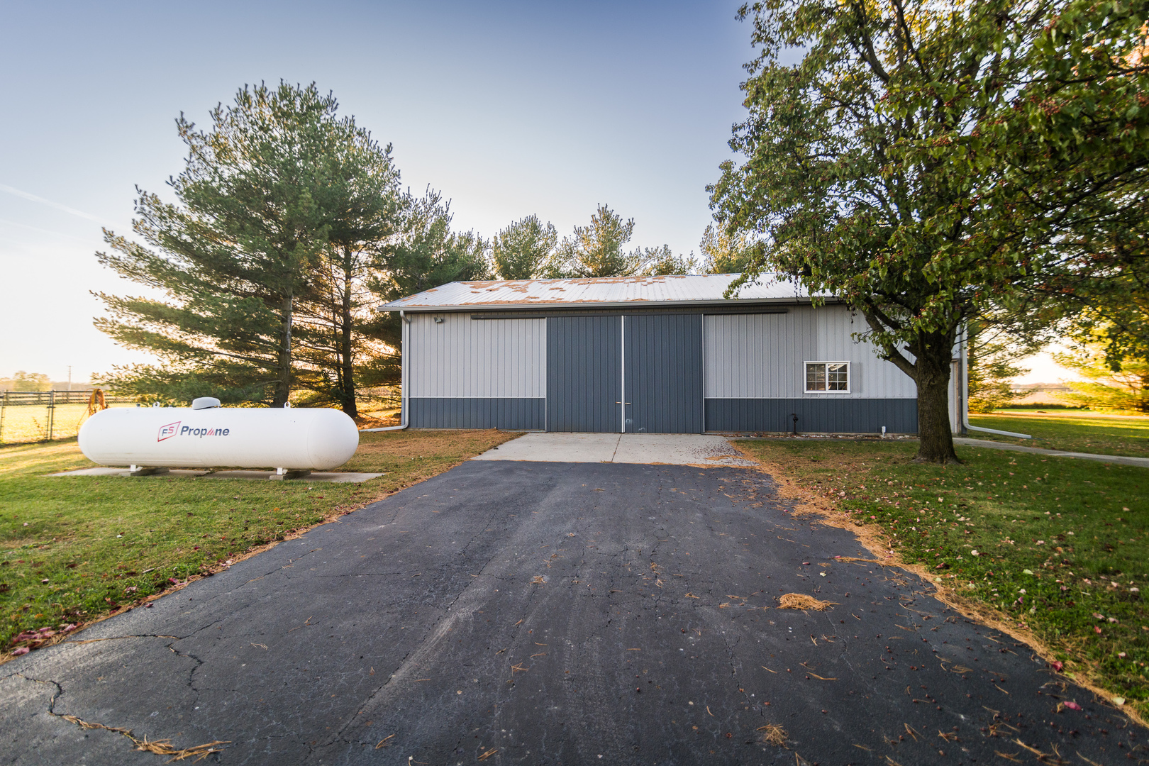 9220 Heritage Road Clinton, IL 61727 - Photo 28 of 37 a front view of a house with a yard and trees