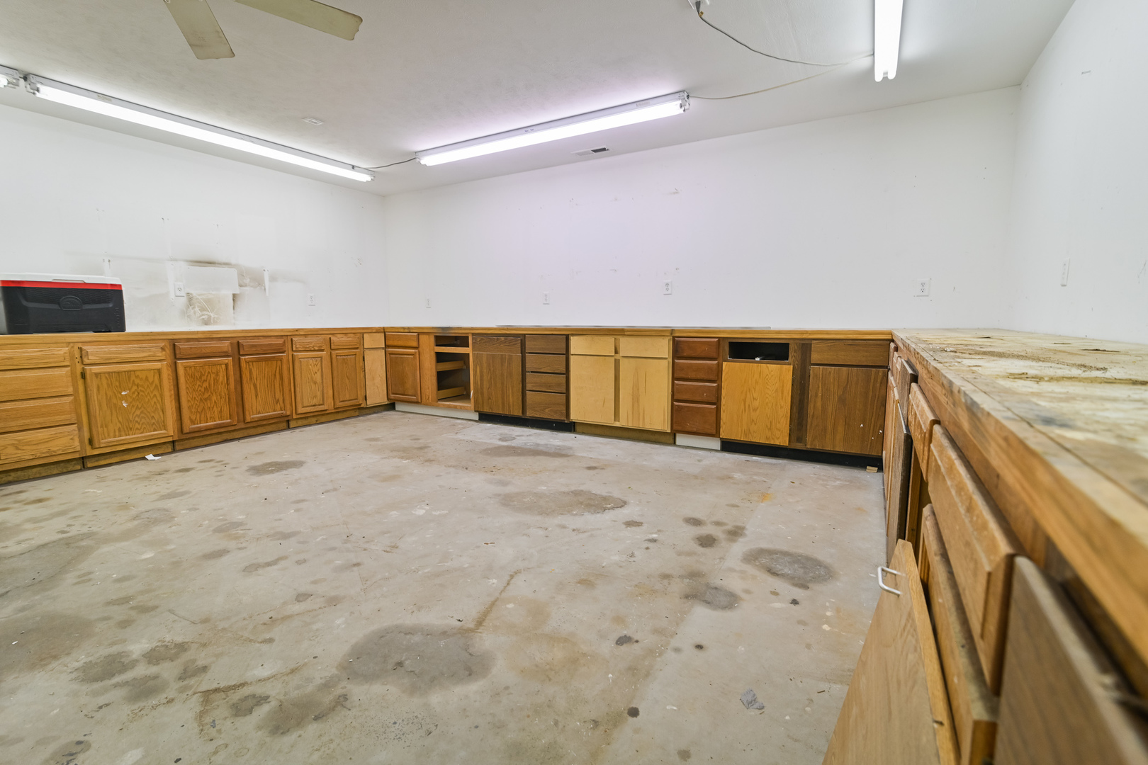 9220 Heritage Road Clinton, IL 61727 - Photo 32 of 37 a view of a kitchen with refrigerator and wooden cabinets