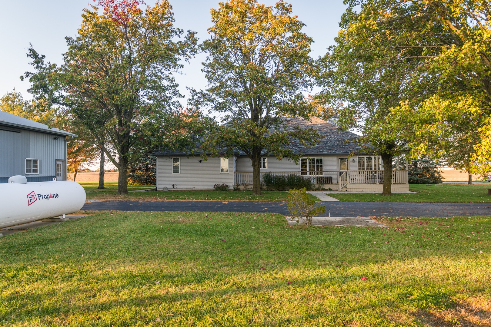9220 Heritage Road Clinton, IL 61727 - Photo 4 of 37 a front view of a house with garden