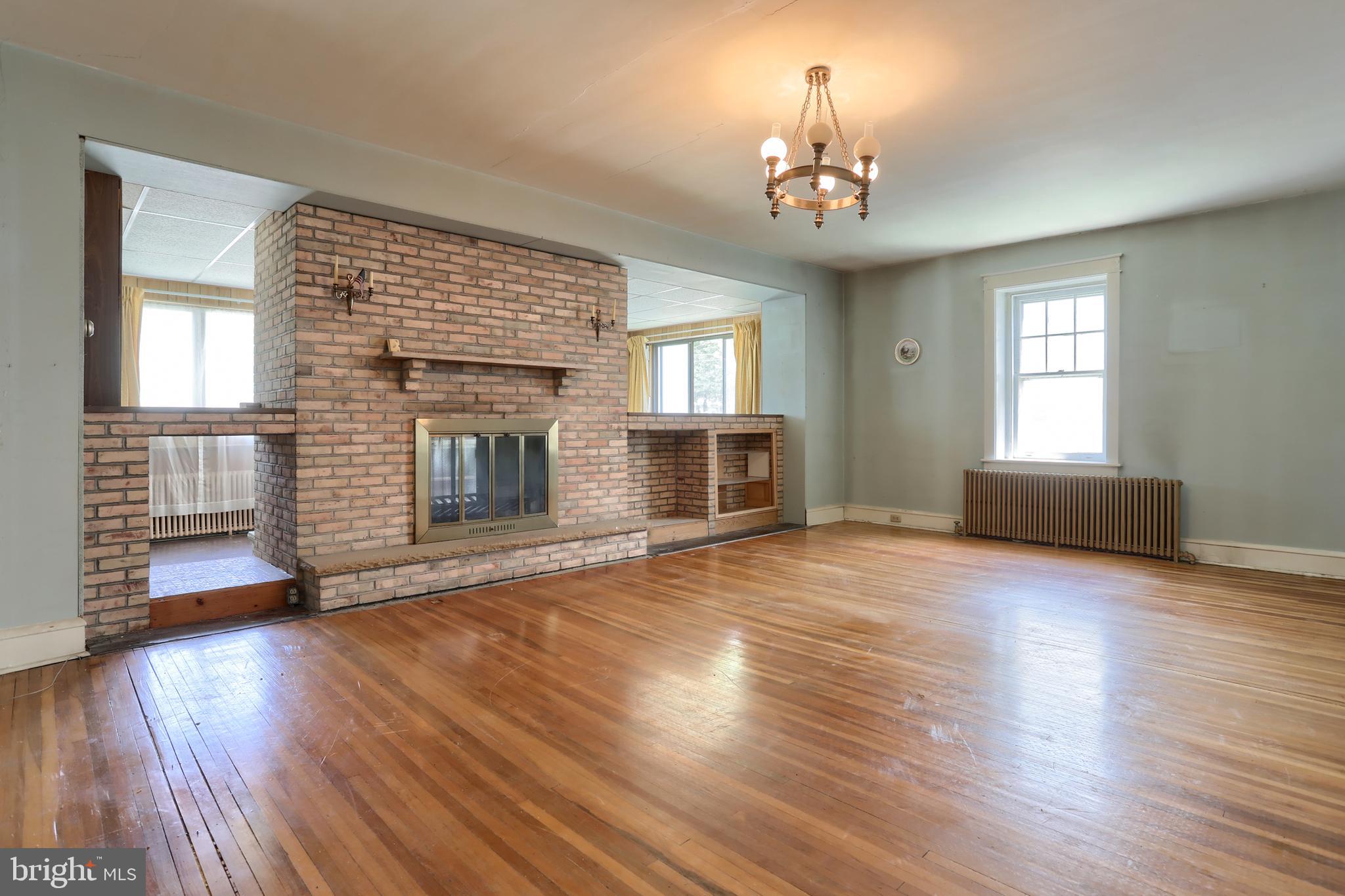 332 East Walnut Street Reading, PA 19607 - Photo 9 of 40 Large Living Room - Double Sided Fireplace