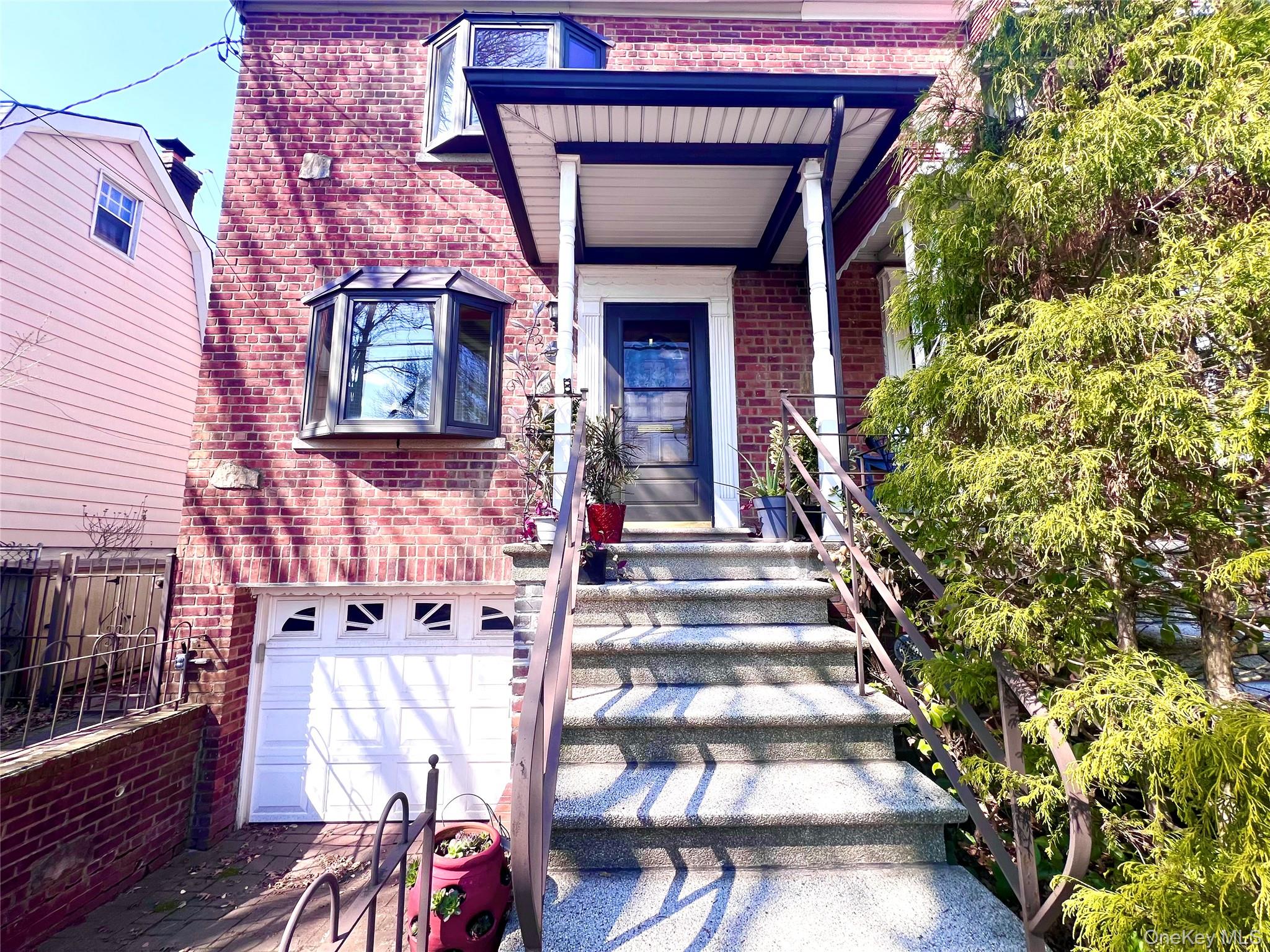 2561 Eastchester Road Bronx, NY 10469 - Photo 2 of 13 a view of a patio with table and chairs and potted plants
