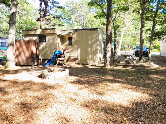 a view of a house with wooden floor and fence