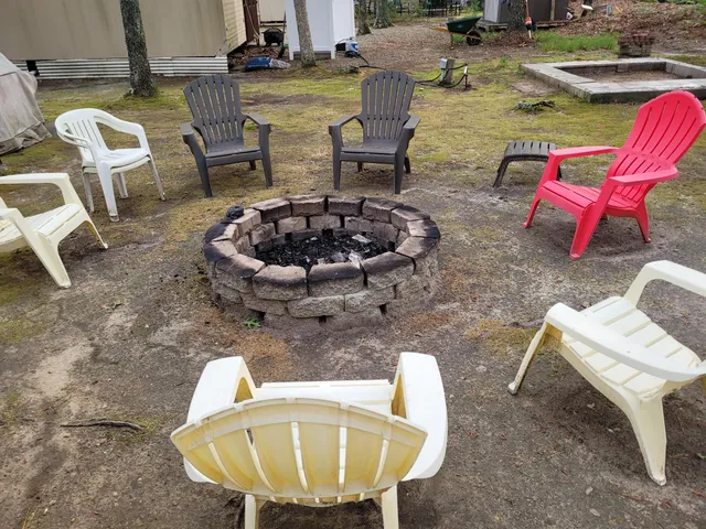 a view of a swimming pool with an outdoor space and seating area